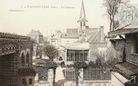 An old postcard showing the house in all its glory with the church in the background