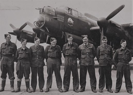 The ground crew for Lancaster ME699, KM-T Tommy pose with the aircraft in July 1944